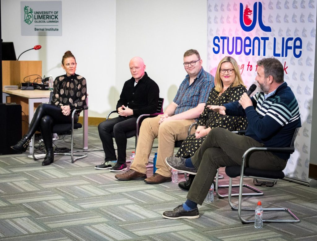 Panel discussion at University of Limerick Student Life event, featuring five seated speakers interacting.