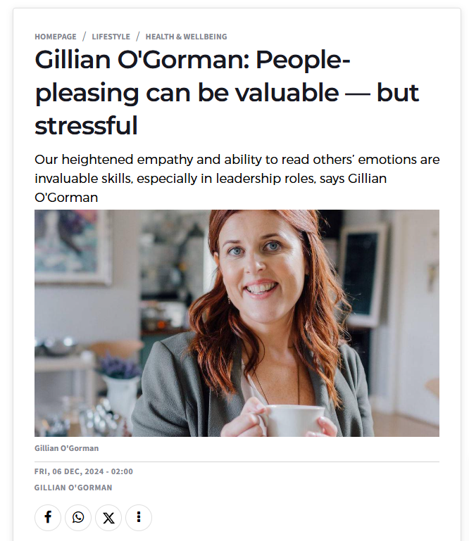 Smiling woman holds a cup, discussing the benefits and stress of people-pleasing in leadership roles.